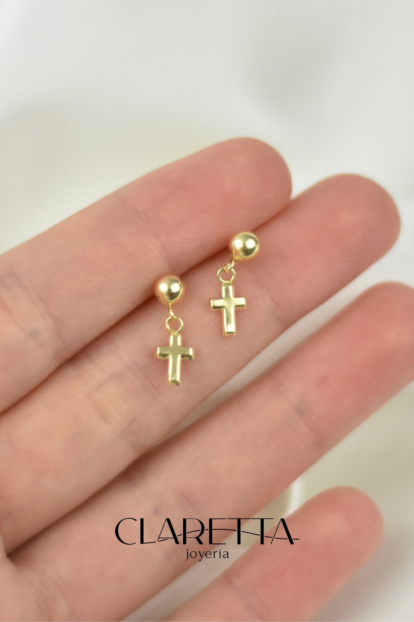 Broquel de cruz colgante