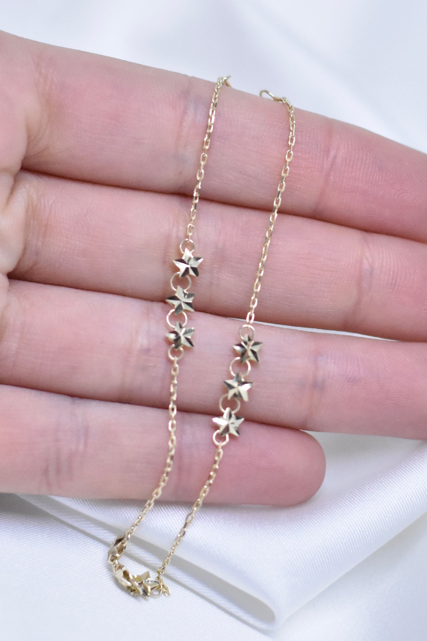 Pulsera con estrellas de oro 10k